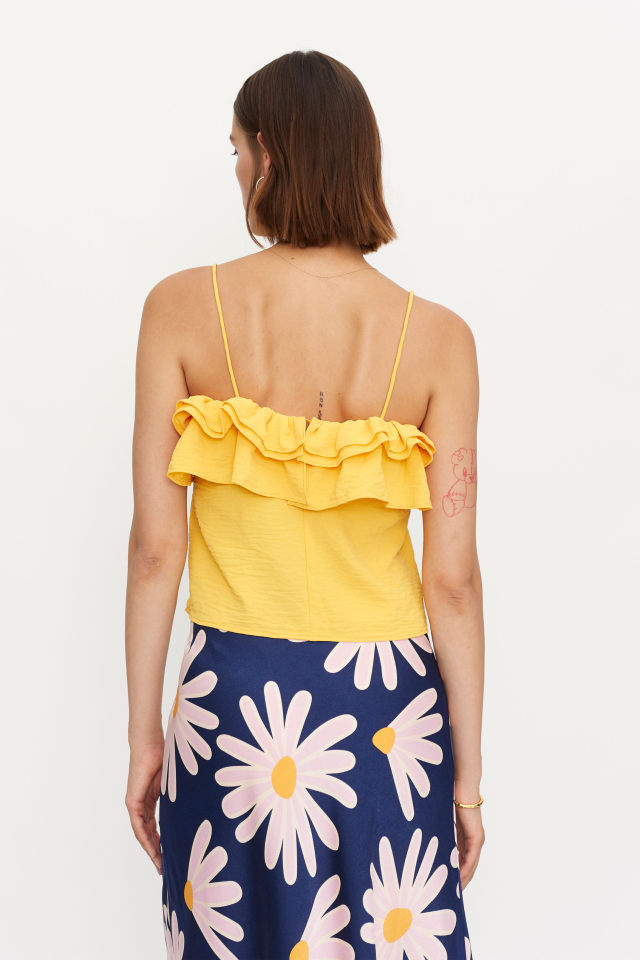 COMPANIA FANTASTICA TOP CON VOLANTE AMARILLO